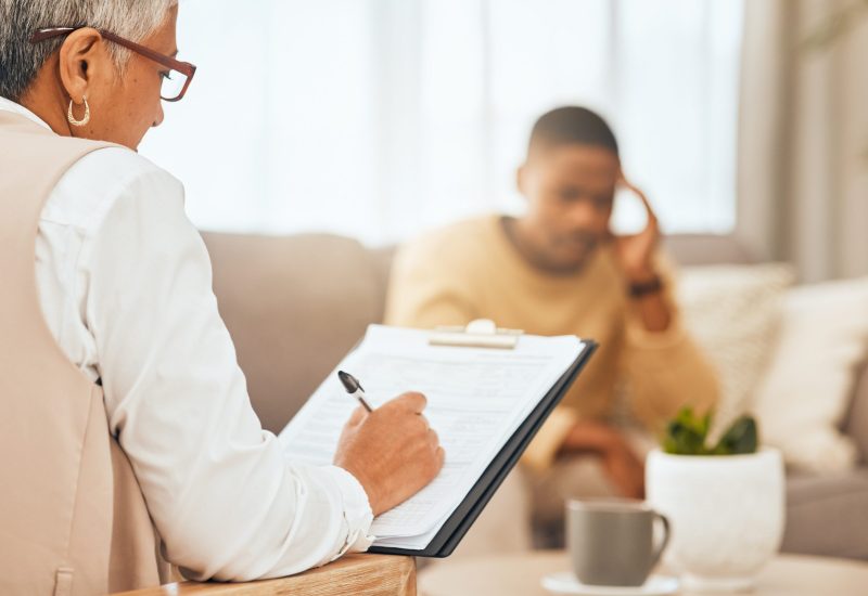 Competency Evaluations For Immigration Proceedings 1 man sofa therapist writing notes clipboard mental health advice consulting office stress anxiety depression sad person psychologist consultation room with patient scaled r58irjtjoc77j84pqtl7regk8rulf271o4v77l4jng