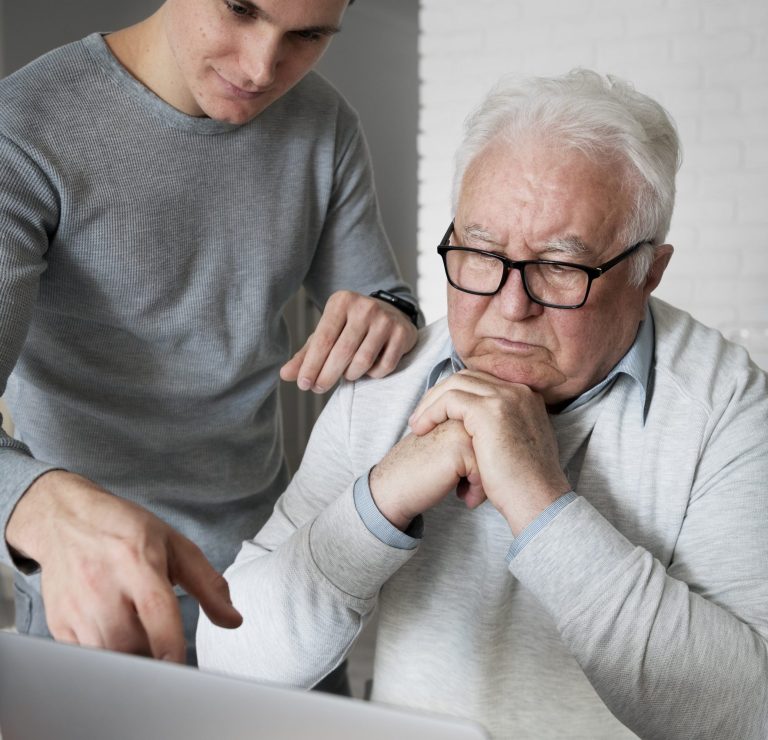 grand parent learning use digital divice scaled e1737653731991
