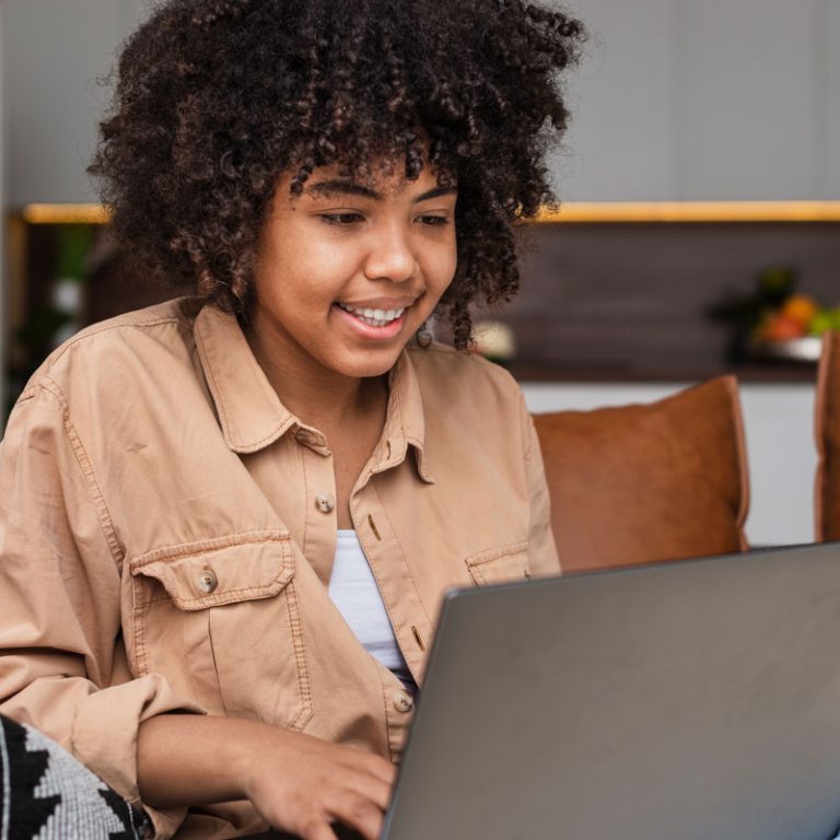 smiling woman working laptop 1