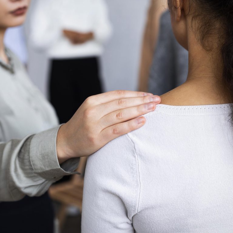 Psychological Evaluations For T-Visa Applicants (I-914) 3 woman consoling person group therapy session e1735318574102