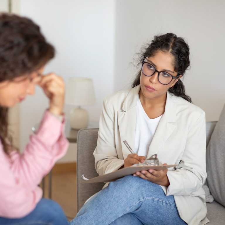 Psychological Evaluations For Vawa Petitions 5 women therapist client sitting couch talking scaled e1735309369805